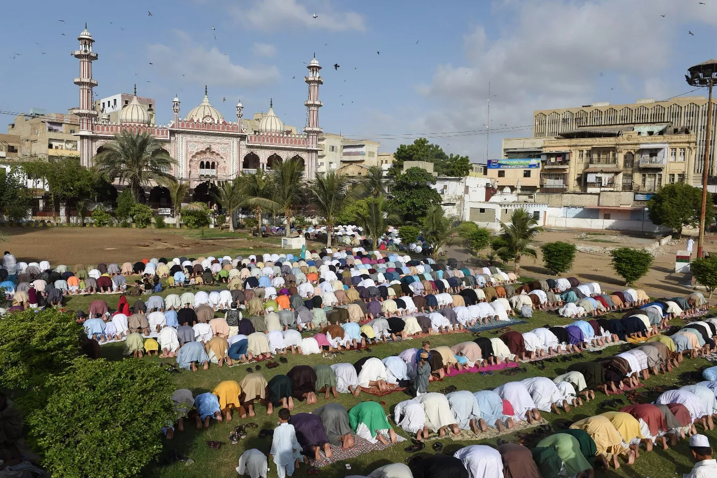 devotees offer eidul azha prayers outside a mosque in karachi on september 25 2015 photo afp