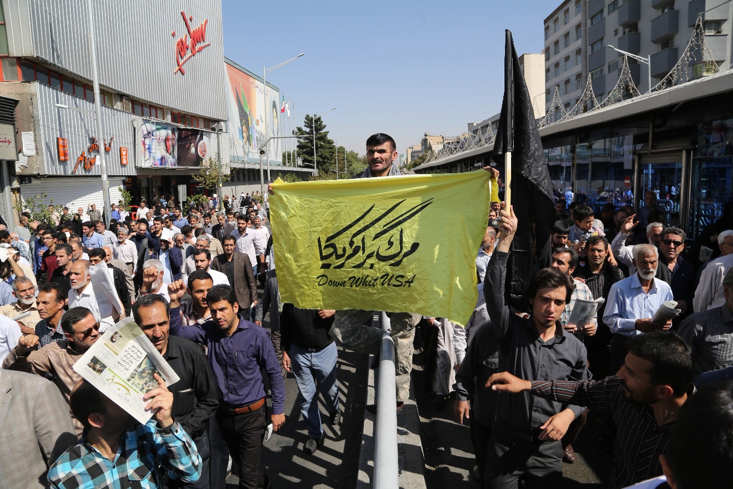 iranian protesters shout slogans and hold anti us signs during a demonstration against saudi arabia after 131 iranians pilgrims were killed in a stampede at the annual hajj on september 25 2015 at enghelab square in tehran photo afp