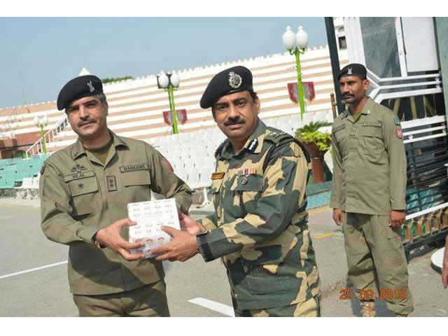 indian and pakistani soldiers exchange sweets and dry fruits on the occasion of eidul azha at the line of control loc in jammu and kashmir on september 25 2015 photo courtesy times of india