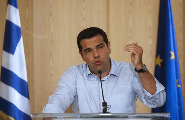 greek prime minister alexis tsipras delivers his speech as he attends a news conference after a meeting at the greek ministry of infrastructure transport and networks in athens greece august 12 2015 photo reuters