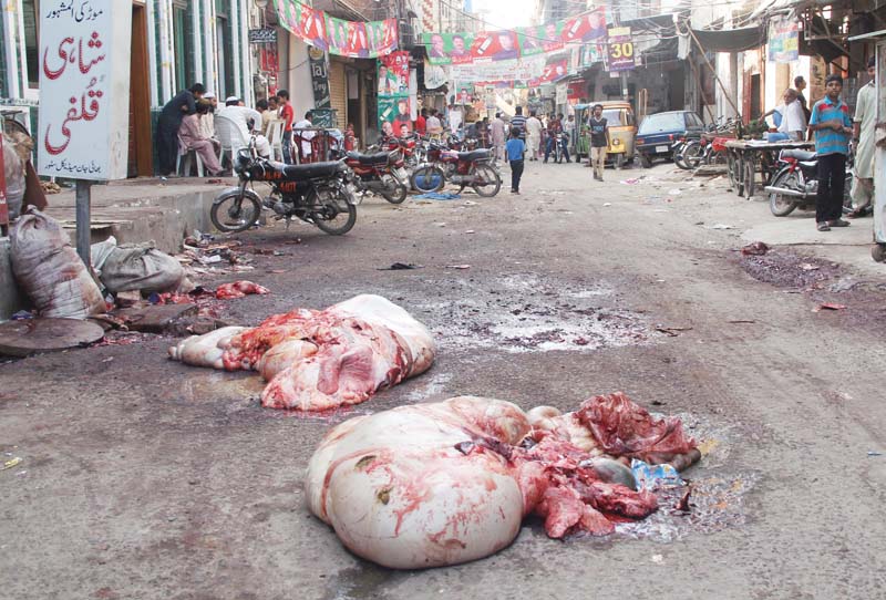 offal and animal waste was seen dumped on the road in various city neighbourhoods photo abid nawaz express