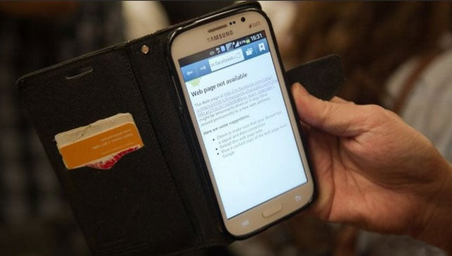 a man shows his smart phone with a message reading quot web page not available quot on the skytrain in bangkok photo afp a man shows his smart phone with a message reading quot web page not available quot on the skytrain in bangkok photo afp