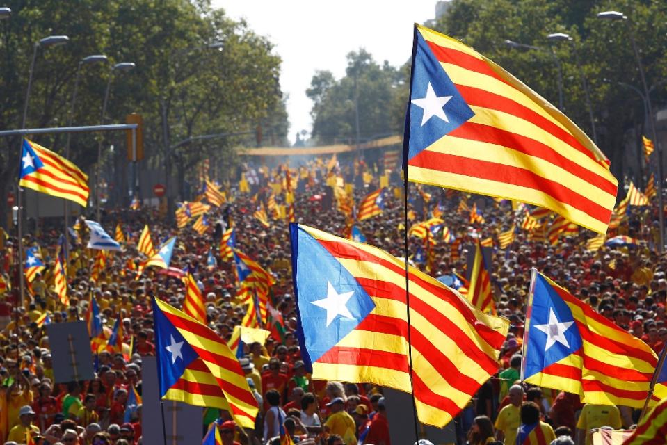 catalans hold independence flags during celebrations for catalonia national day in barcelona on september 11 2014 photo afp