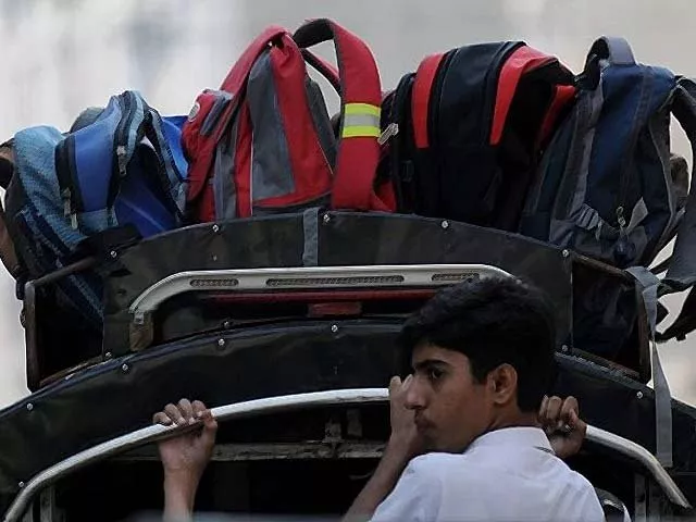 pakistani schoolchildren hold on to rails as they travel on a school van photo afp pakistani schoolchildren hold on to rails as they travel on a school van photo afp