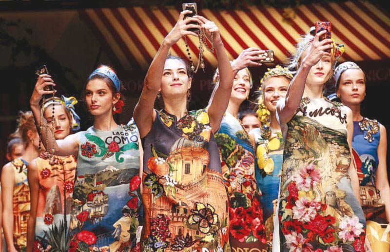 models take selfies during the parade at the end of the dolce amp gabbana spring summer 2016 collection photo reuters