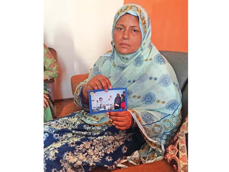 dr shahzeb raza s wife holds a picture of her husband waiting for news of his whereabouts photo express