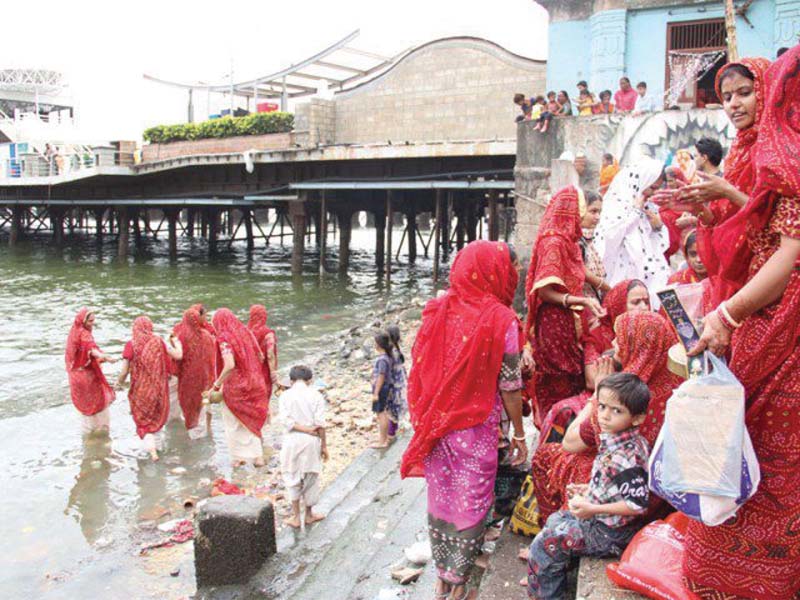 members of the hindu community performing their religious duties at the 200 year old sri laxmi narain temple near native jetty some portions of the temple were demolished during the construction of port grand authorities have yet to restore parts of the temple despite the lapse of three years photo file