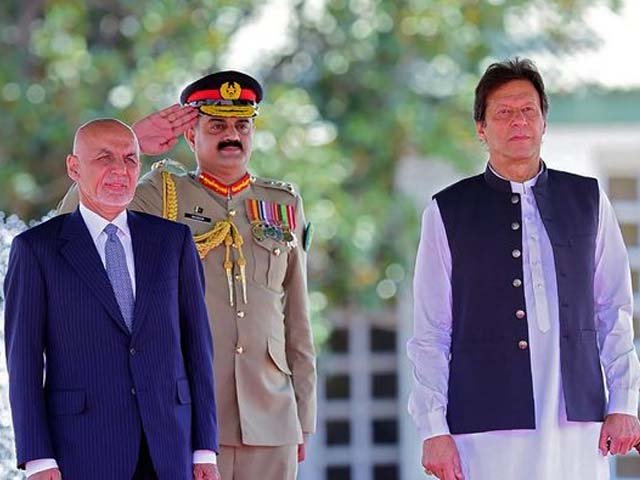 visiting afghan president ashraf ghani and prime minister imran khan review an honour guard photo afp