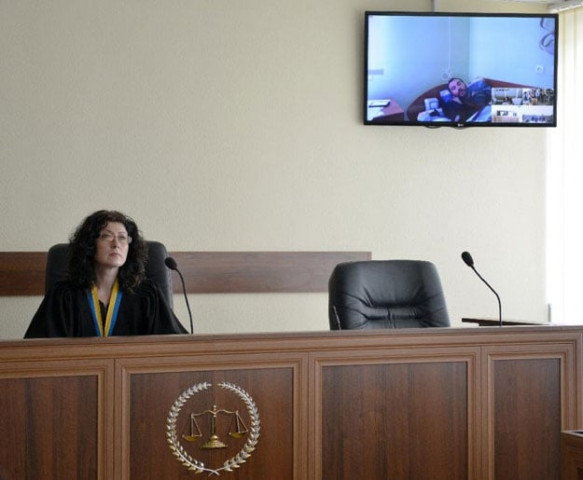 a kiev district court judge questions one of the two captured russian soldiers videoconference from a hospital on may 22 2015 photo afp a kiev district court judge questions one of the two captured russian soldiers videoconference from a hospital on may 22 2015 photo afp