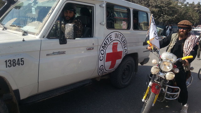 taliban fighters are seen in an international committee of the red cross icrc vehicle a day after the insurgents overran the strategic northern city of kunduz on september 29 2015 photo afp