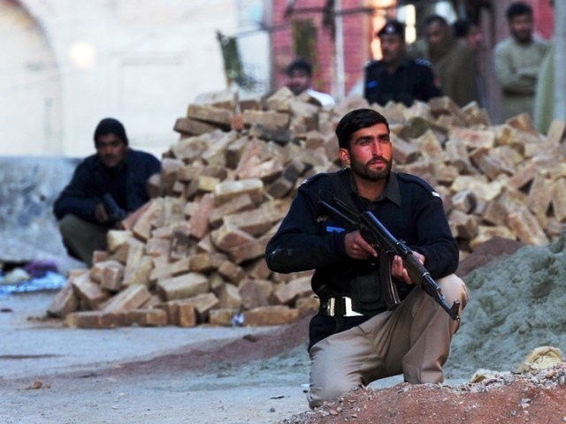 in this file photo a policeman stands guard in khyber pakhtunkhwa photo afp