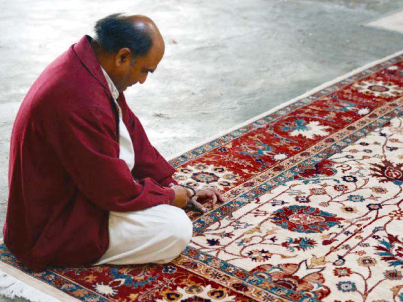 dastgir said that government was determined to facilitate the hand knotted carpet industry photo file