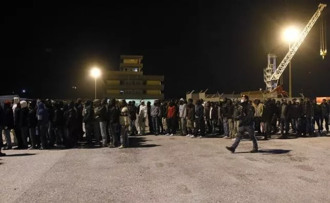 police escort migrants as they are disembarked from a navy ship in the sicilian harbour of augusta march 4 2015 photo reuters police escort migrants as they are disembarked from a navy ship in the sicilian harbour of augusta march 4 2015 photo reuters