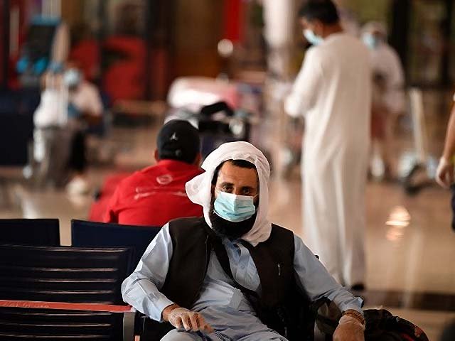 a pakistani national waits at the dubai international airport photo afp a pakistani national waits at the dubai international airport photo afp