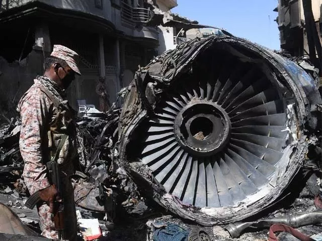 security personnel stand beside the wreckage of the plane photo afp security personnel stand beside the wreckage of the plane photo afp