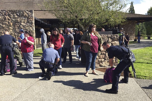 police officers inspect bags as students and staff are evacuated from campus following a shooting incident at umpqua community college in roseburg oregon october 1 2015 photo reuters