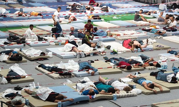 refugees in a sports hall in deggendorf southern germany photo afp