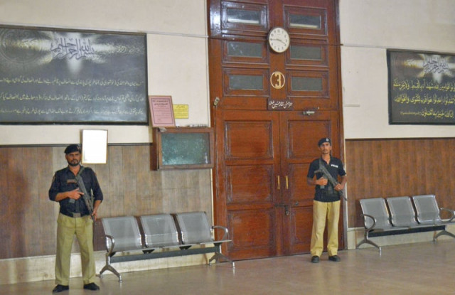 police personnel stand inside peshawar high court during the strike photo inp police personnel stand inside peshawar high court during the strike photo inp