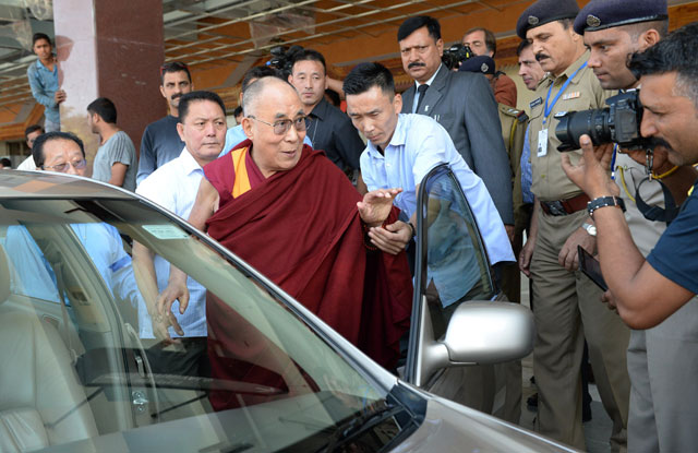 dalai lama gestures after arriving at dharamsala airport in dharamsala on october 3 2015 photo afp