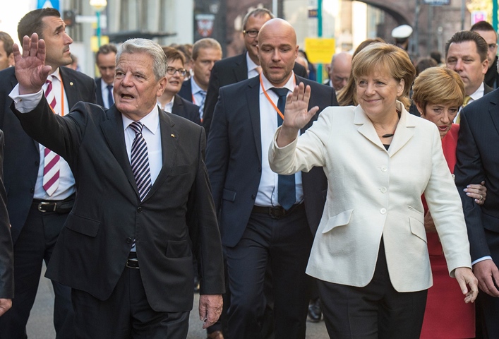 german chancellor angela merkel r and german president joachim gauck wave on october 3 2015 in frankfurt as germany celebrates 25 years since its reunification photo afp