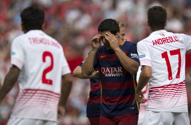 barcelona 039 s luis suarez reacts after missing a scoring opportunity during their spanish first division soccer match against sevilla at ramon sanchez pizjuan stadium in seville southern spain october 3 2015 photo reuters