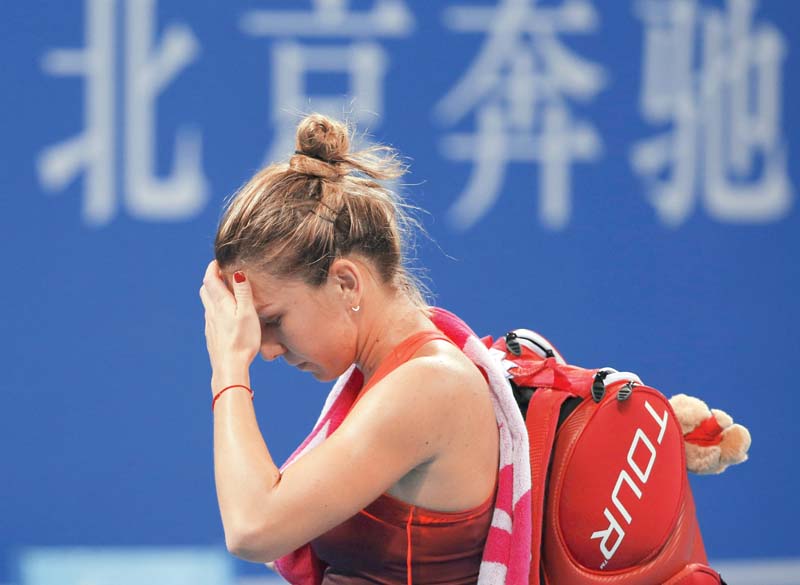 halep was downcast after the return of a left achilles tendon injury which first troubled her in 2011 and flared anew at last month s guangzhou open photo afp