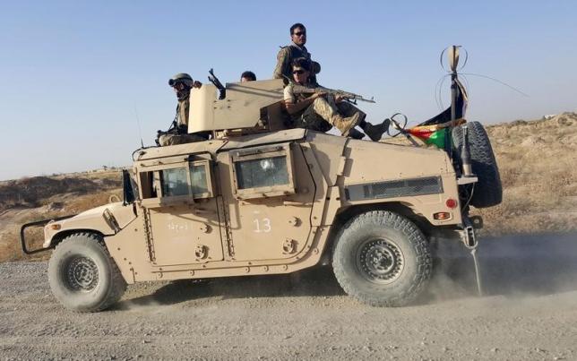 afghan security forces sit on top of a vehicle as they patrol outside of kunduz city on october 1 2015 photo reuters