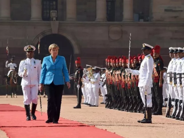 german chancellor angela merkel inspects the guard of honour during a ceremonial reception at the presidential palace in new delhi on october 5 2015 photo afp german chancellor angela merkel inspects the guard of honour during a ceremonial reception at the presidential palace in new delhi on october 5 2015 photo afp