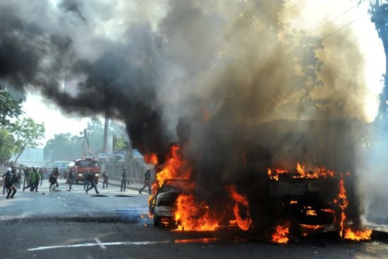 burning vehicles set on fire by opposition demonstrators are pictured during violent protests in dhaka bangladesh on january 6 2015 photo afp