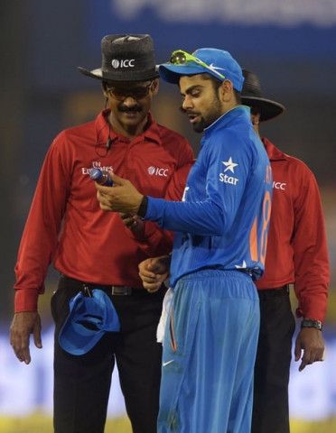 india 039 s virat kohli c shows a bottle thrown in the ground to the umpires as play is interrupted by spectators throwing bottles onto the pitch during the second t20 cricket match between india and south africa at the barabati stadium in cuttack photo afp india 039 s virat kohli c shows a bottle thrown in the ground to the umpires as play is interrupted by spectators throwing bottles onto the pitch during the second t20 cricket match between india and south africa at the barabati stadium in cuttack photo afp