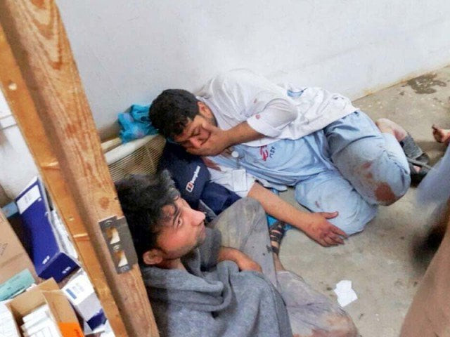 medics take cover after an airstrike hit the kunduz hospital photo afp medics take cover after an airstrike hit the kunduz hospital photo afp