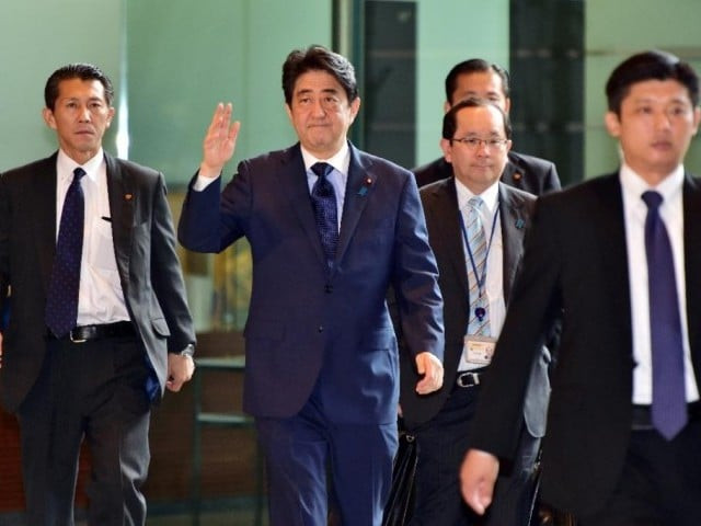 japan 039 s prime minister shinzo abe c waves upon his arrival at his official residence in tokyo on september 18 2015 photo afp japan 039 s prime minister shinzo abe c waves upon his arrival at his official residence in tokyo on september 18 2015 photo afp