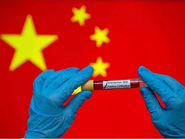 hands wearing medical gloves hold a coronavirus positive blood sample photo afp hands wearing medical gloves hold a coronavirus positive blood sample photo afp