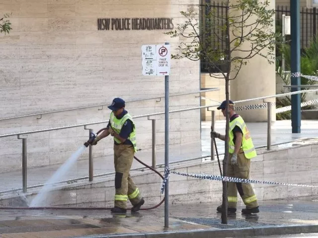 a fireman hoses down the scene where a 15 year old gunman shot dead a civilian police employee the previous day before being himself gunned down by police in sydney on october 3 2015 photo afp a fireman hoses down the scene where a 15 year old gunman shot dead a civilian police employee the previous day before being himself gunned down by police in sydney on october 3 2015 photo afp