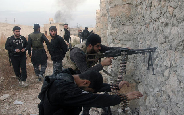 syrian rebel fighters shoot through a hole in a wall towards forces loyal to the regime in 2013 in aleppo photo afp