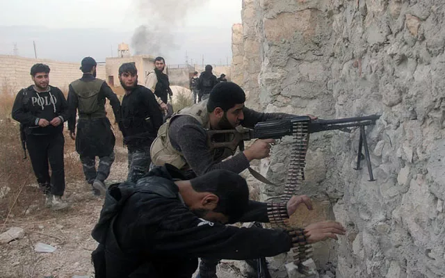 syrian rebel fighters shoot through a hole in a wall towards forces loyal to the regime in 2013 in aleppo photo afp syrian rebel fighters shoot through a hole in a wall towards forces loyal to the regime in 2013 in aleppo photo afp