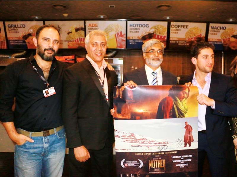 pakistani ambassador receives a signed poster from the lead actors and director of the film photos publicity