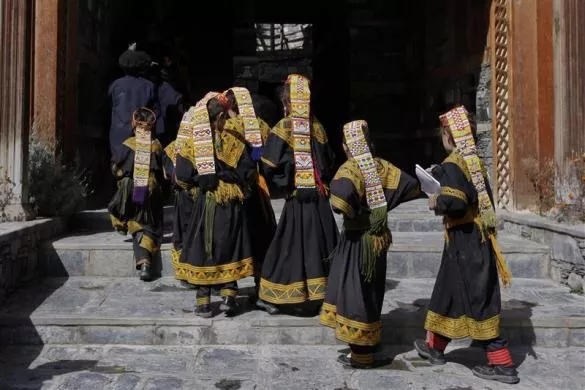 kalash female students walk to class through the entrance of the kalasha dur and community centre in brun village located in bumboret kalash valley photo reuters kalash female students walk to class through the entrance of the kalasha dur and community centre in brun village located in bumboret kalash valley photo reuters