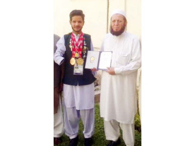 ali with the principal and faculty of his college in sector h 8 photo express ali with the principal and faculty of his college in sector h 8 photo express