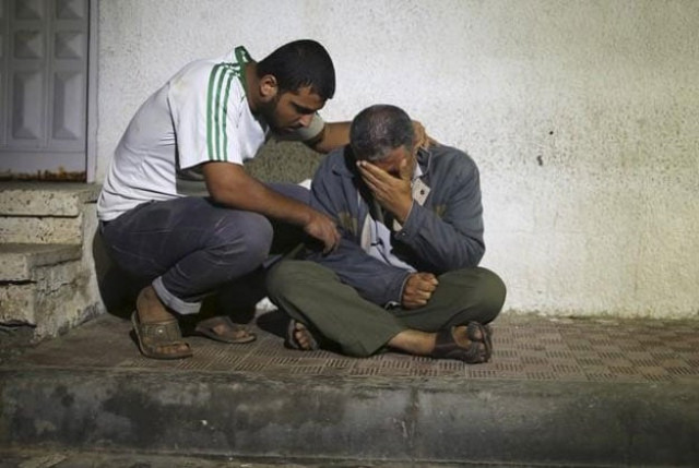 relatives react outside a hospital morgue after a three year old palestinian girl and her mother were killed after their house was brought down by an israeli air strike in gaza early on october 11 2015 relatives react outside a hospital morgue after a three year old palestinian girl and her mother were killed after their house was brought down by an israeli air strike in gaza early on october 11 2015