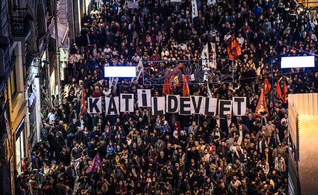 placards reading quot killer state quot are seen as protesters take part in a march against the deadly attack earlier in ankara on october 10 2015 at the istiklal avenue in istanbul photo afp