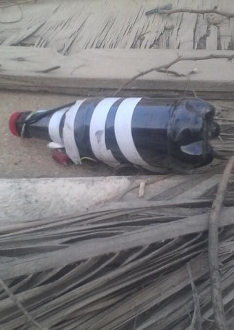 a bomb concealed in a bottle was found lying on mqm candidate 039 s rooftop photo karachi police a bomb concealed in a bottle was found lying on mqm candidate 039 s rooftop photo karachi police