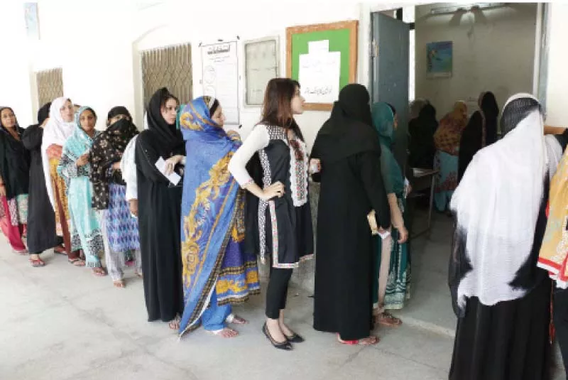 women in a queue at a polling station in dharampura photo shafiq malik express women in a queue at a polling station in dharampura photo shafiq malik express