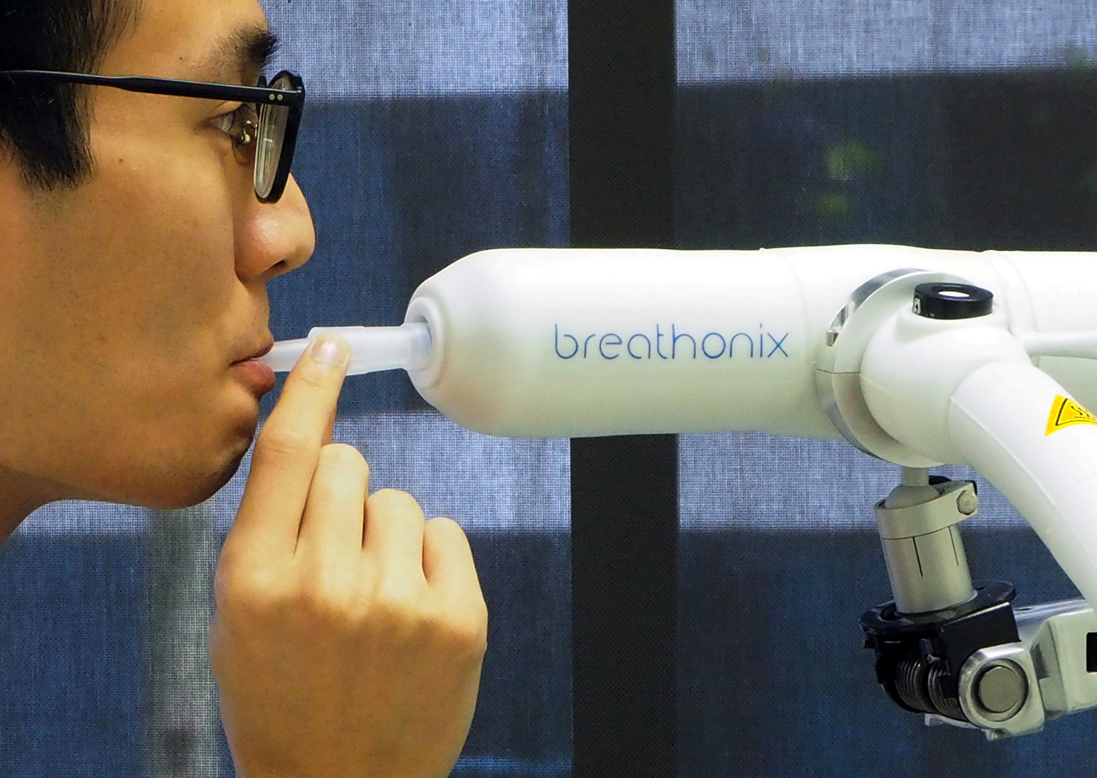 a staff member demonstrates the usage of breathonix breathalyzer test kit developed by breathonix a start up by the national university of singapore able to detect the coronavirus disease covid 19 within a minute according to the company at their laboratory in singapore october 29 2020 photo reuters