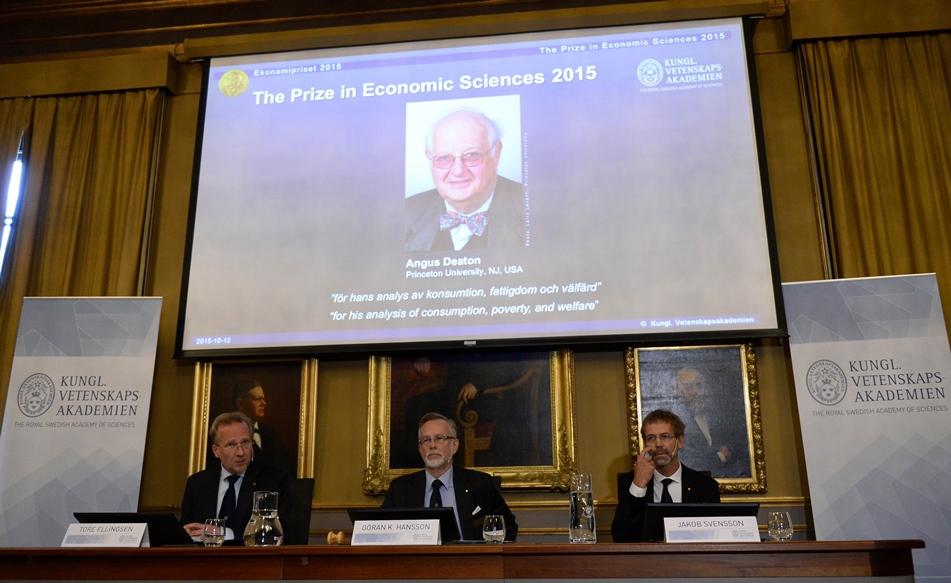 goeran k hansson permanent secretary of the royal swedish academy of sciences c announces angus deaton of britain as the winner of the 2015 nobel economics prize next to members of the prize committee tore ellingsen l and jakob svensson on october 12 2015 in stockholm photo afp