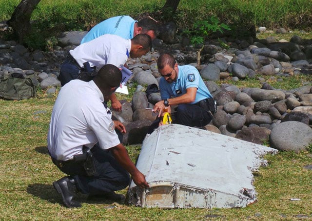 french gendarmes and police inspecting a large piece of plane debris which was found on the beach in saint andre on the french indian ocean island of la reunion july 29 2015 photo reuters french gendarmes and police inspecting a large piece of plane debris which was found on the beach in saint andre on the french indian ocean island of la reunion july 29 2015 photo reuters