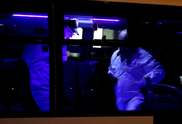 israeli forensic policemen inspect the scene where an arab man on a jerusalem bus stabbed an off duty israeli soldier and tried to grab his weapon lightly wounding him before being shot dead by security forces on october 12 2015 in jerusalem photo afp