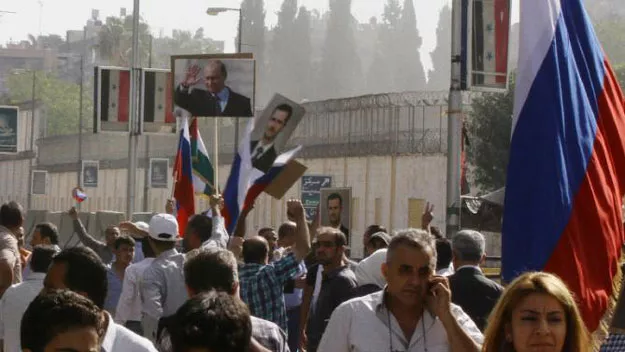 hundreds of people holding russian and syrian flags as well as portraits of the two countries 039 presidents gather near the russian embassy in damascus on october 13 2015 to express their support for moscow 039 s air war in syria photo afp hundreds of people holding russian and syrian flags as well as portraits of the two countries 039 presidents gather near the russian embassy in damascus on october 13 2015 to express their support for moscow 039 s air war in syria photo afp