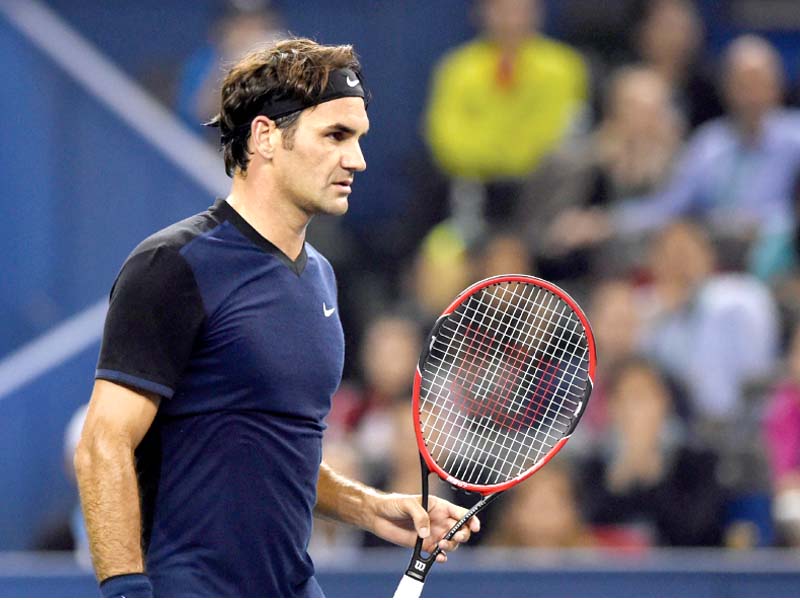 federer caused his own downfall in the final game as he netted a forehand to bring up match point and then misfired a backhand return to leave a disbelieving ramos vinolas saluting the crowd photo afp