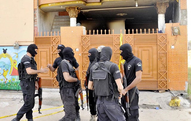 personnel of punjab police 039 s elite force stand outside the house they raided in rawalpindi on october 15 2015 photo nni personnel of punjab police 039 s elite force stand outside the house they raided in rawalpindi on october 15 2015 photo nni